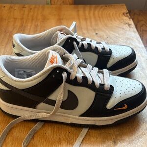 Nike Black and White Sneakers with Orange Details
